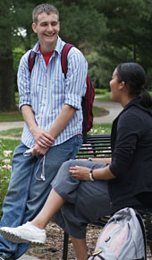 Two students talk on campus