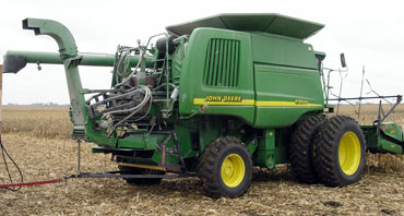 John Deere combine with attachments to harvest corn stover
