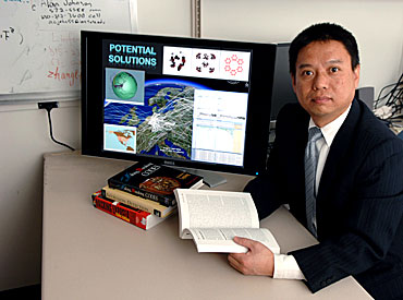 Yong Guan works in his Iowa State office to track down cyber criminals.