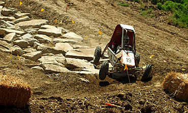 Iowa State's Mini Baja Team competes over mud, rocks and hills at Caterpillar's Edwards Demonstration Facility near Peoria, Ill.