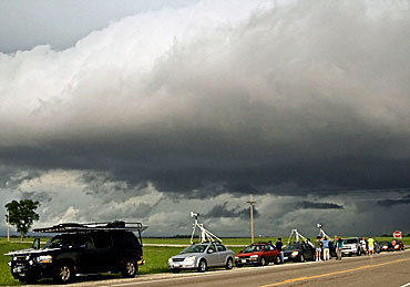 The TWISTEX crew, including Iowa State students, watches a storm develop in rural Kansas.