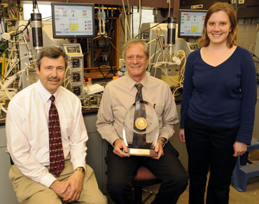 Iowa State researchers Anthony L. Pometto III, Hans van Leeuwen and Mary Rasmussen display the 2008 Grand Prize for University Research recently awarded by the American Academy of Environmental Engineers.