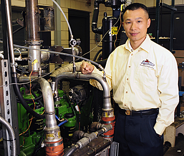 Song-Charng Kong in his Iowa State engine lab.