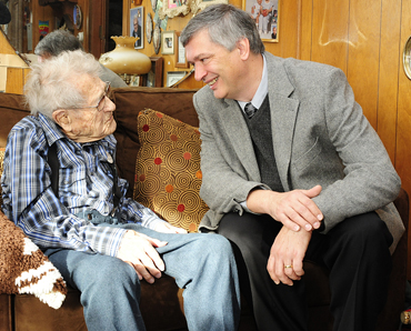 Peter Martin, director of Iowa State's Gerontology Program, with local centenarian John Persinger.