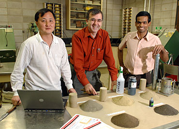 Halil Ceylan (center) and his research team in Iowa State University's soil engineering laboratory.